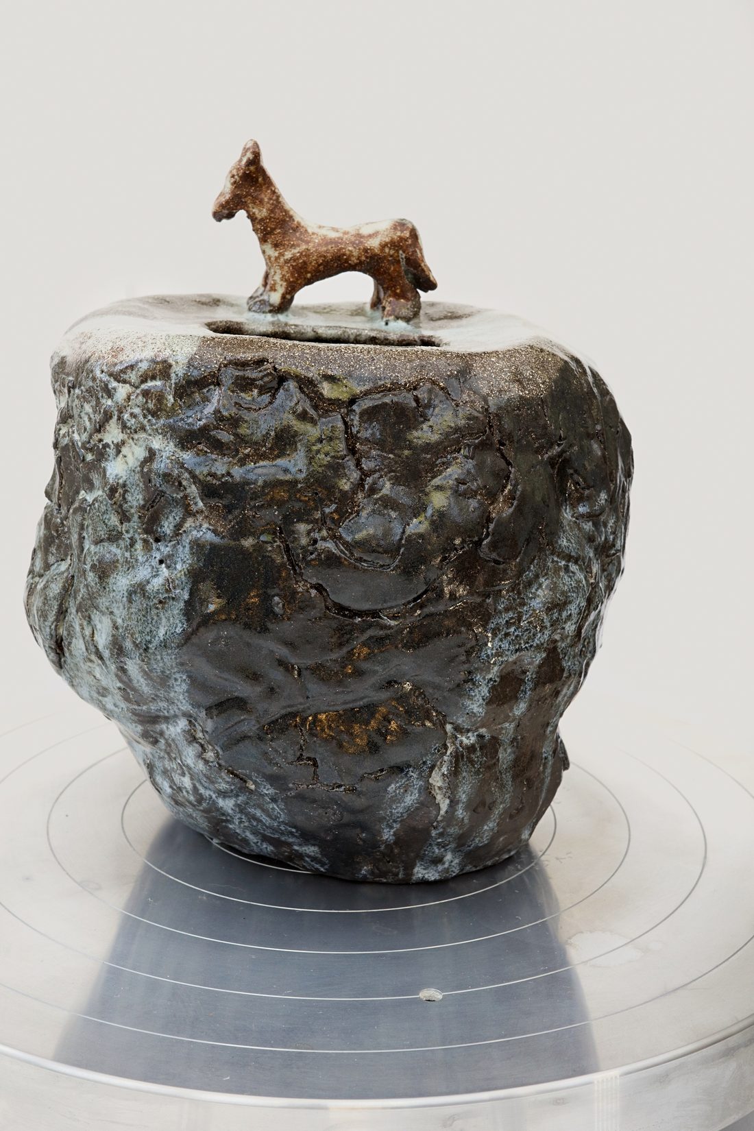 In Search Of Home — textured lidded jar topped with a small modelled horse.