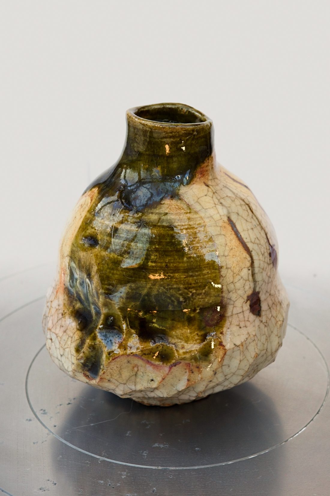 Persimmon — sake bottle with dark Oribe glaze pooling over a pale clay body.