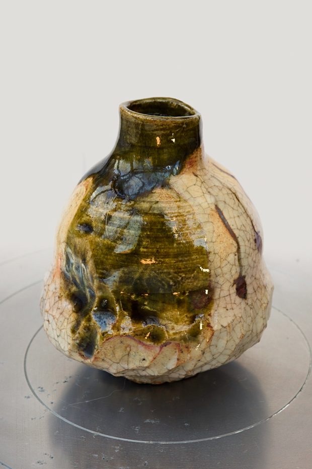 Persimmon — sake bottle with dark Oribe glaze pooling over a pale clay body.
